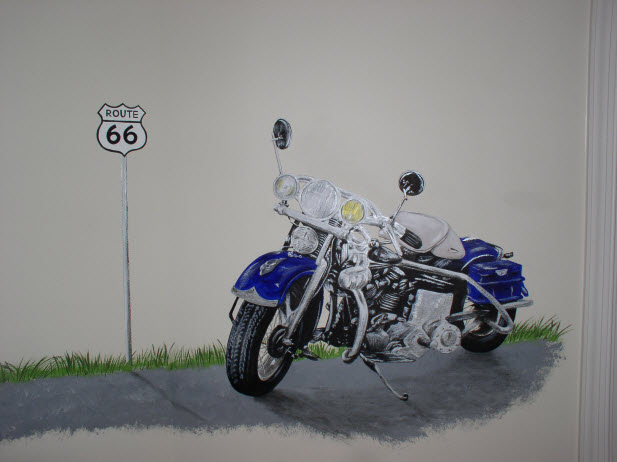 Mural of a motorcycle painted in a boy's bedroom