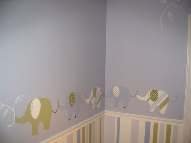 Mural of elephants painted in a nursery room